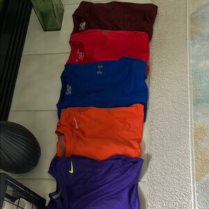 Under Armour (3) shirts and Nike (2) shirts